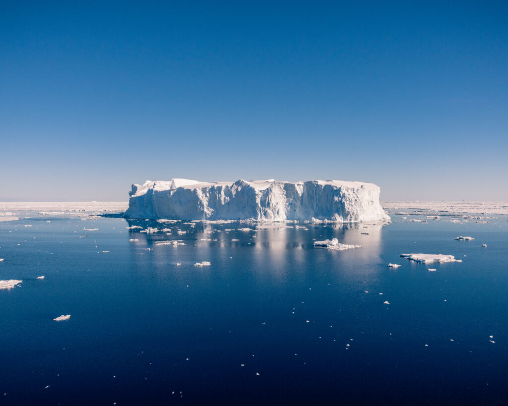 Iceberg on blue sea