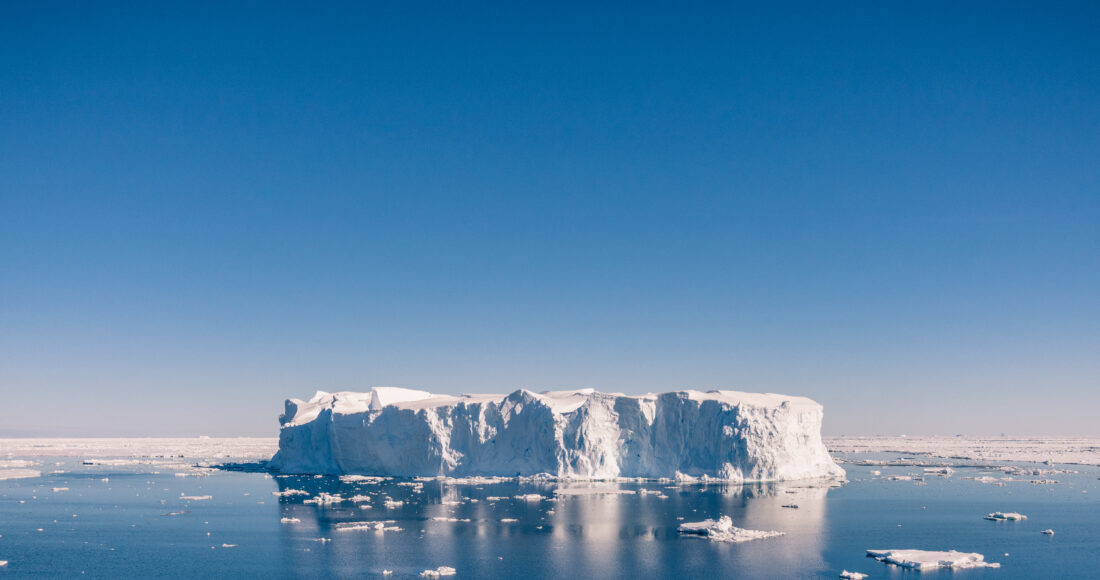 Iceberg on blue sea
