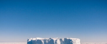 Iceberg on blue sea