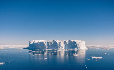Iceberg on blue sea